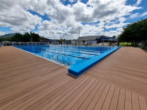 linear decking surrounding aquatic centre outdoor pool