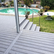 composite decking patio and steps leading to pool