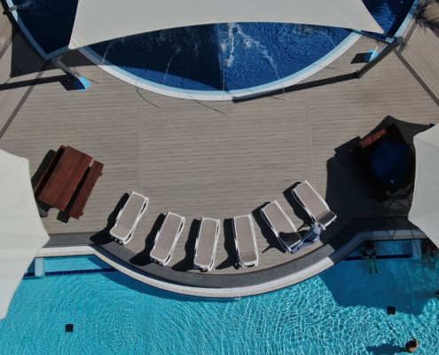 curved decking surrounding swimming pool