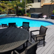 curved decking around small swimming pool